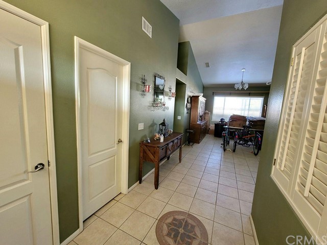 12915 Lompoc Road Apple Valley, CA 92308 - Photo 4 of 23 a lobby with furniture and a large window
