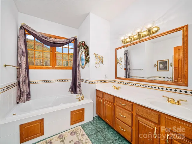 a bathroom with a sink a mirror and a bathtub