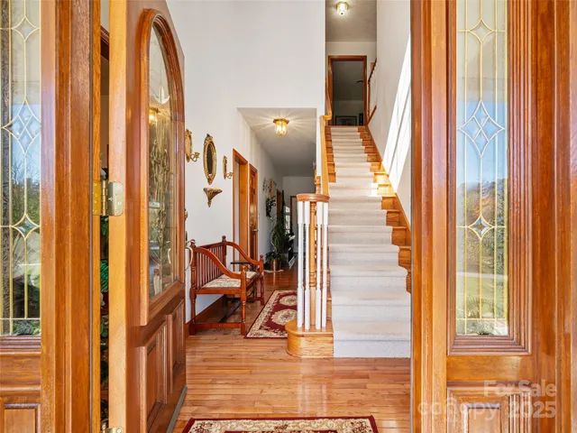 a view of entryway and hall with dining room