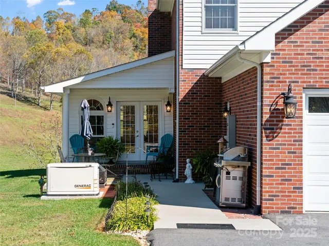 a view of a patio with table and chairs and potted plants