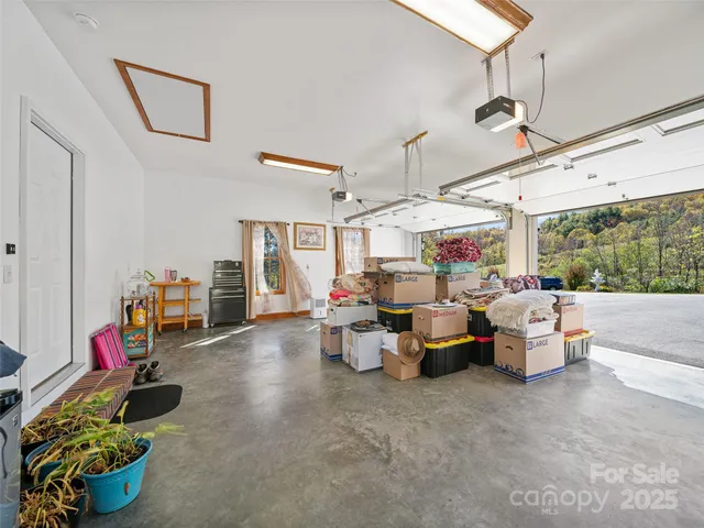 a living room with lots of furniture and a chandelier