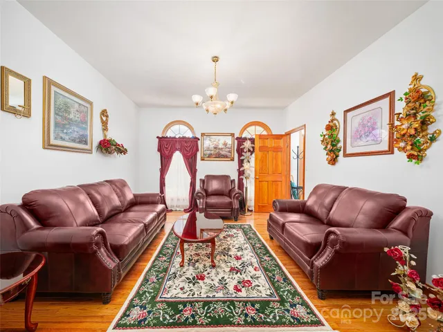 a living room with furniture or couch and a table