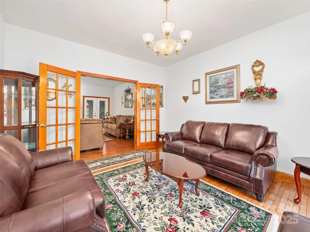 a living room with furniture ceiling fan and a rug