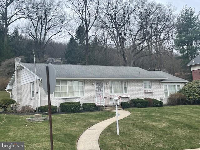 2146 Fairview Avenue Reading, PA 19606 - Photo 1 of 25 a front view of a house with garden