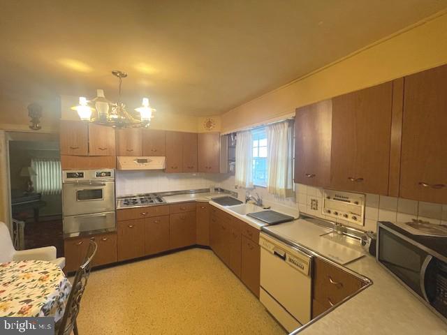 2146 Fairview Avenue Reading, PA 19606 - Photo 13 of 25 a kitchen with cabinets a sink and appliances