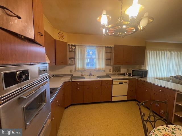 2146 Fairview Avenue Reading, PA 19606 - Photo 15 of 25 a large kitchen with a large window a sink stainless steel appliances and cabinets