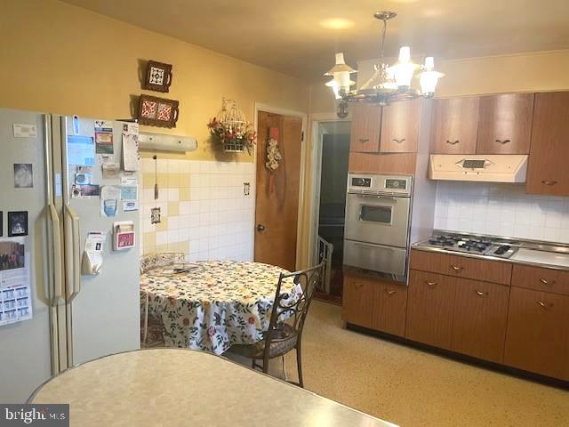 2146 Fairview Avenue Reading, PA 19606 - Photo 17 of 25 a kitchen with stainless steel appliances a refrigerator sink and stove