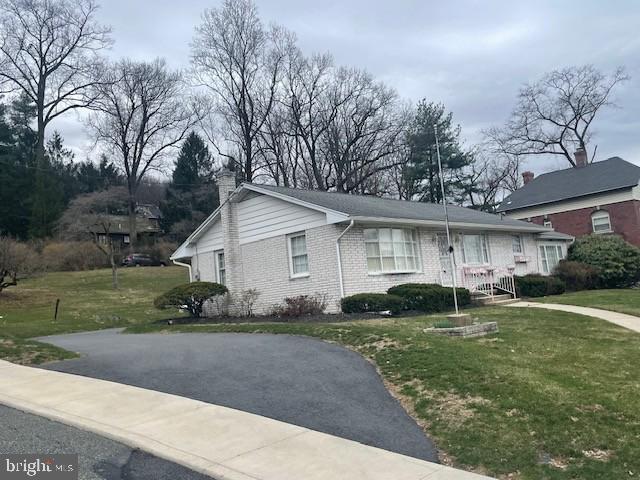 2146 Fairview Avenue Reading, PA 19606 - Photo 2 of 25 a front view of a house with a yard and garage