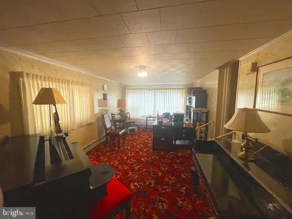 a living room with furniture rug and wooden floor