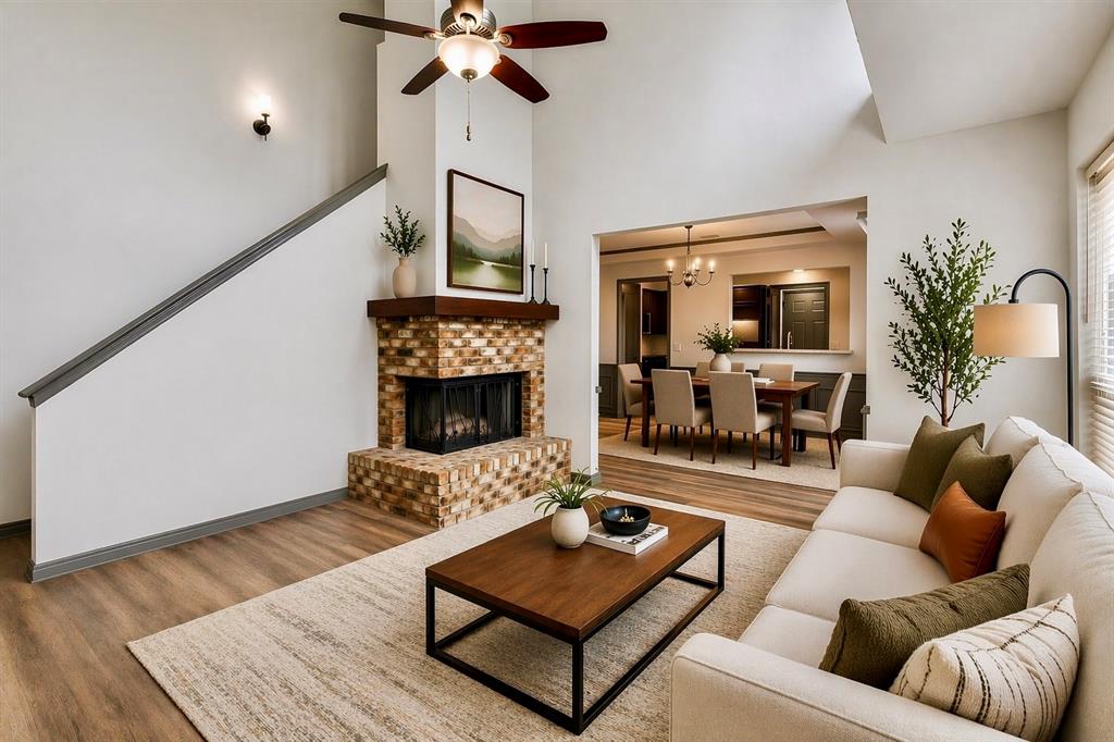 17079 Upper Bay Road Addison, TX 75001 - Photo 11 of 24 a living room with furniture and a fireplace