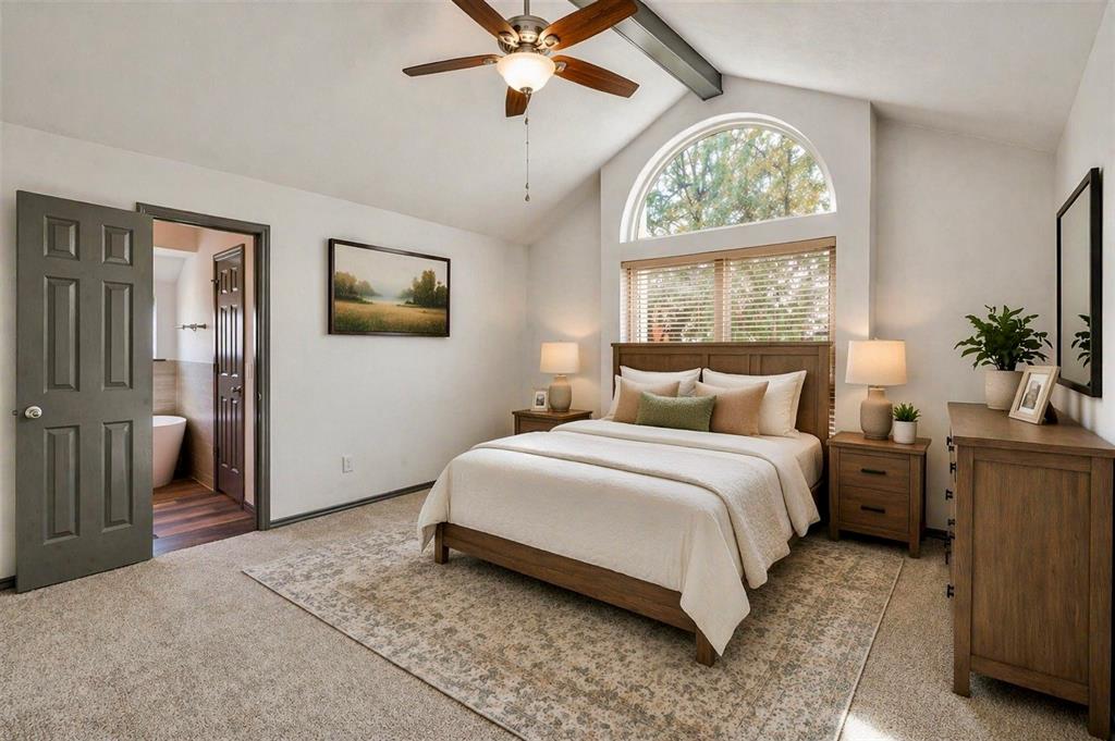 17079 Upper Bay Road Addison, TX 75001 - Photo 12 of 24 a bedroom with a large bed and a window