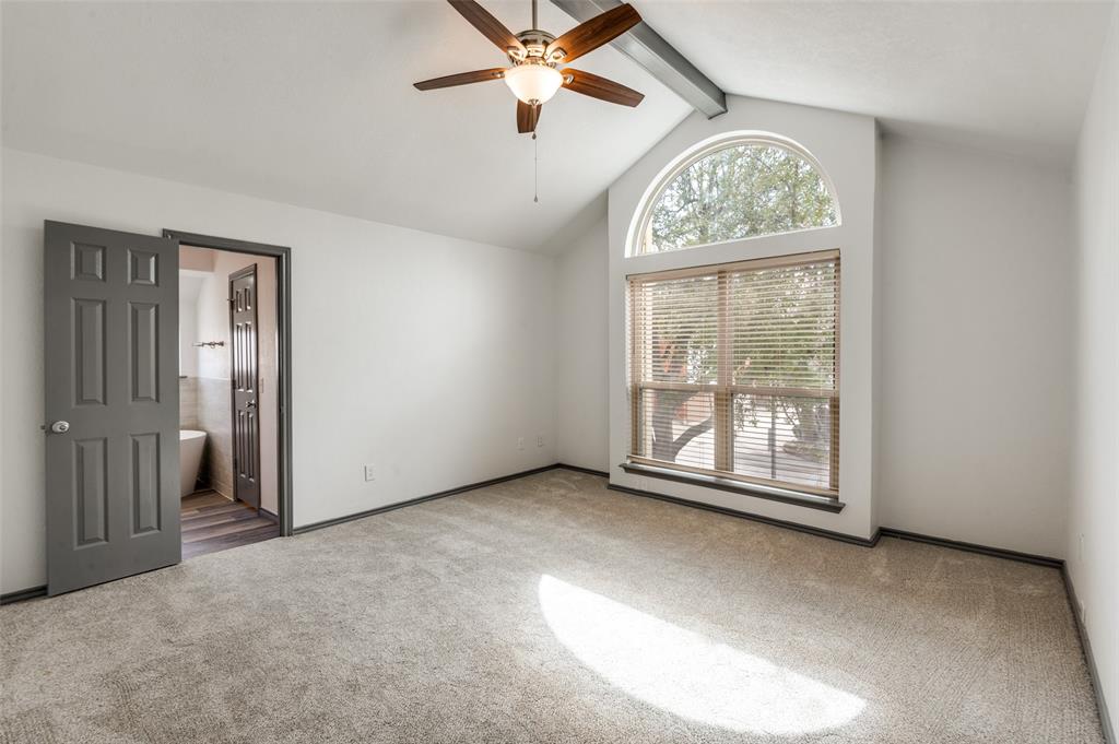 17079 Upper Bay Road Addison, TX 75001 - Photo 12 of 24 an empty room with windows and fan