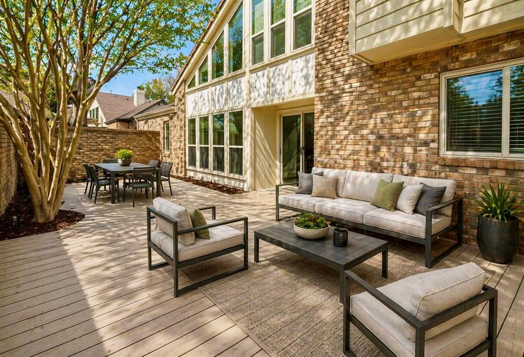 17079 Upper Bay Road Addison, TX 75001 - Photo 17 of 24 a view of a patio with couches and a potted plant on a table