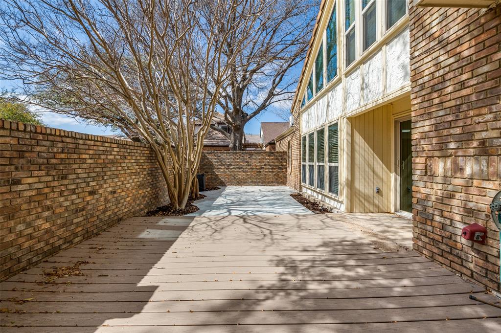17079 Upper Bay Road Addison, TX 75001 - Photo 18 of 24 a view of a yard with brick walls