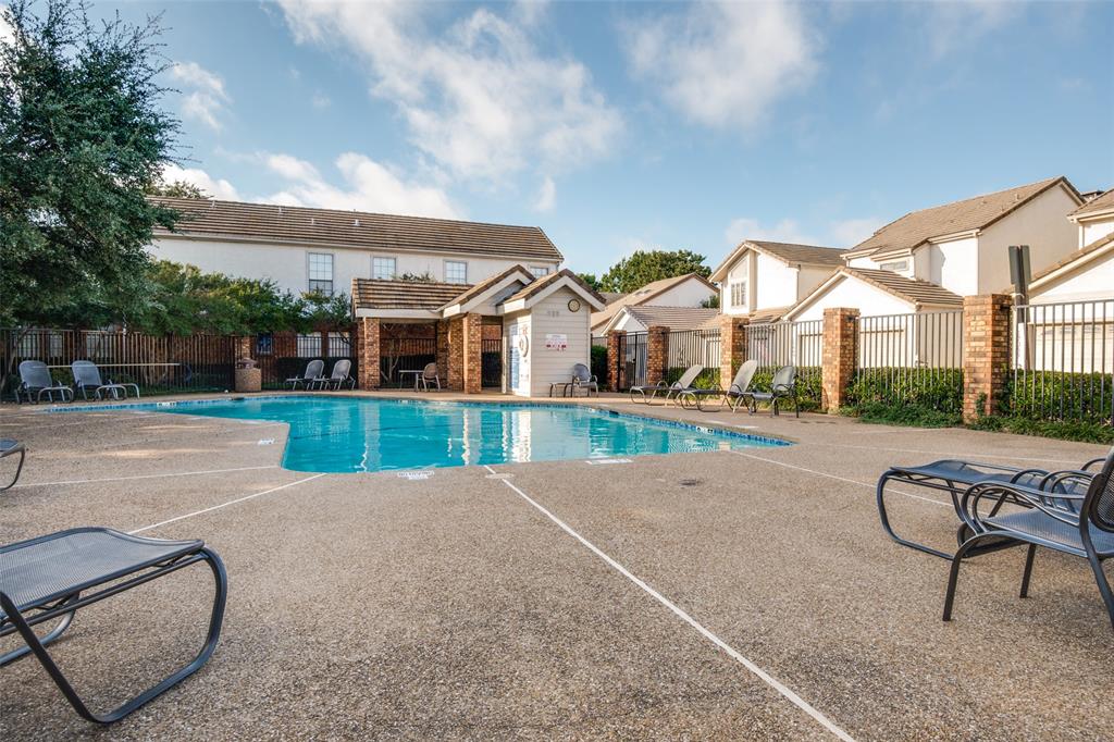 17079 Upper Bay Road Addison, TX 75001 - Photo 20 of 24 a view of a house with a swimming pool and a yard