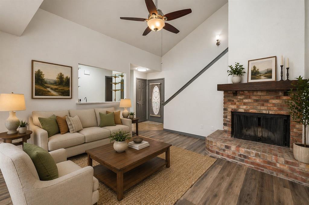 17079 Upper Bay Road Addison, TX 75001 - Photo 2 of 24 a living room with furniture and a fireplace