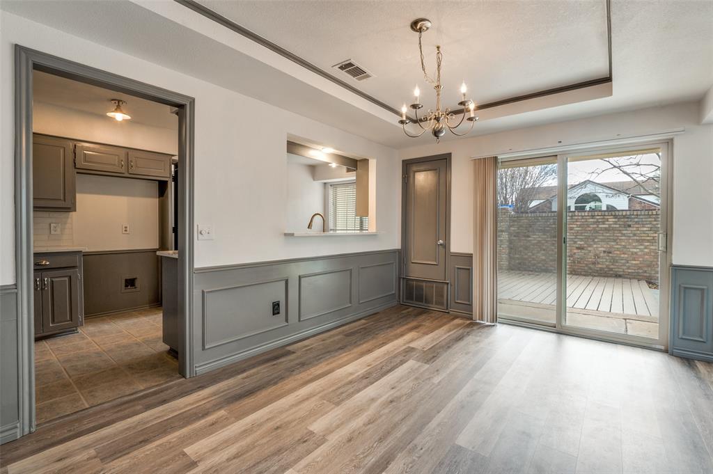 17079 Upper Bay Road Addison, TX 75001 - Photo 6 of 24 a spacious bathroom with a double vanity sink a large mirror and shower