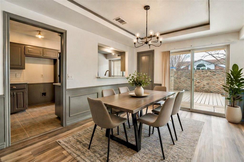 17079 Upper Bay Road Addison, TX 75001 - Photo 6 of 24 a view of a dining room with furniture window and wooden floor