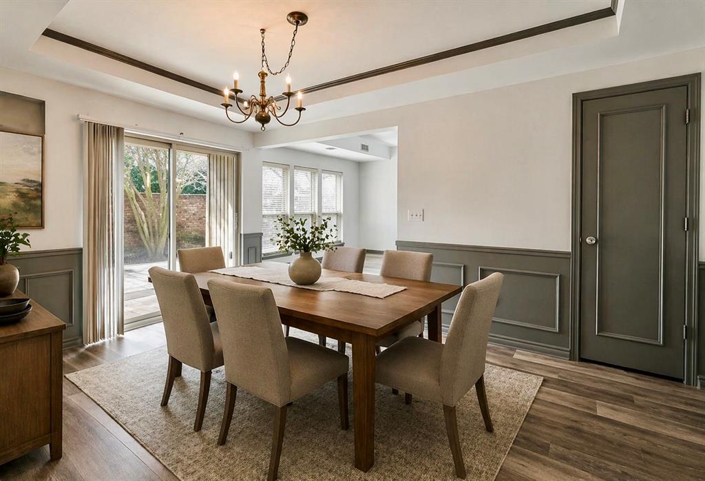 17079 Upper Bay Road Addison, TX 75001 - Photo 7 of 24 a view of a dining room with furniture window and wooden floor