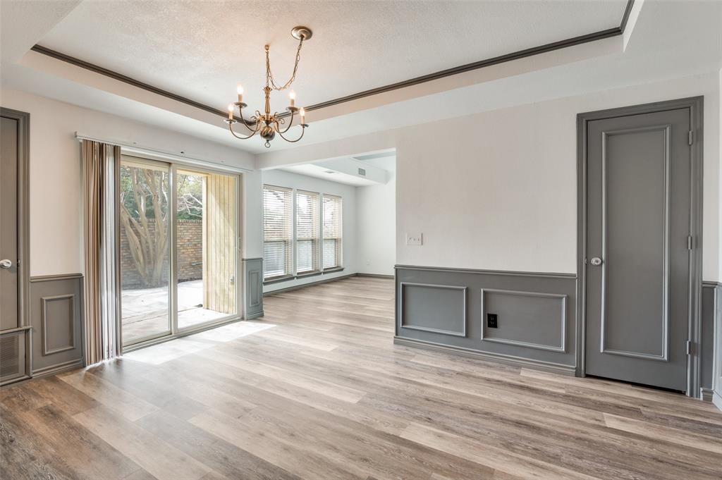 17079 Upper Bay Road Addison, TX 75001 - Photo 7 of 24 a view of an empty room with wooden floor and a window
