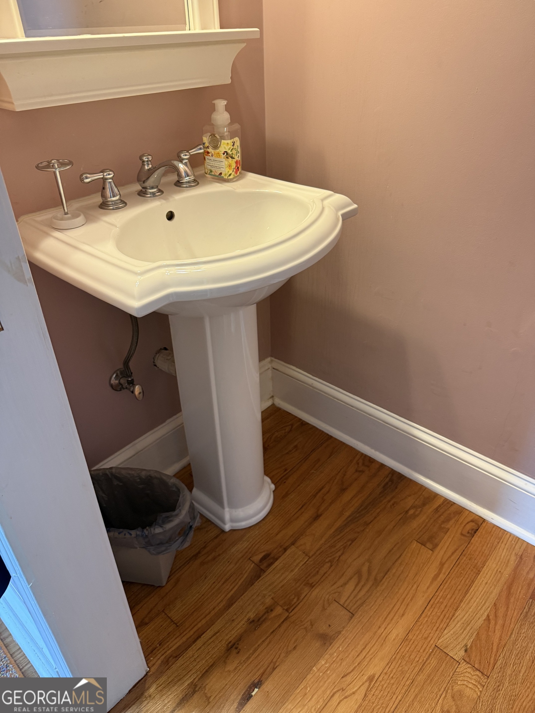 1591 Waymanville Road Thomaston, GA 30286 - Photo 17 of 24 a bathroom with a sink and mirror