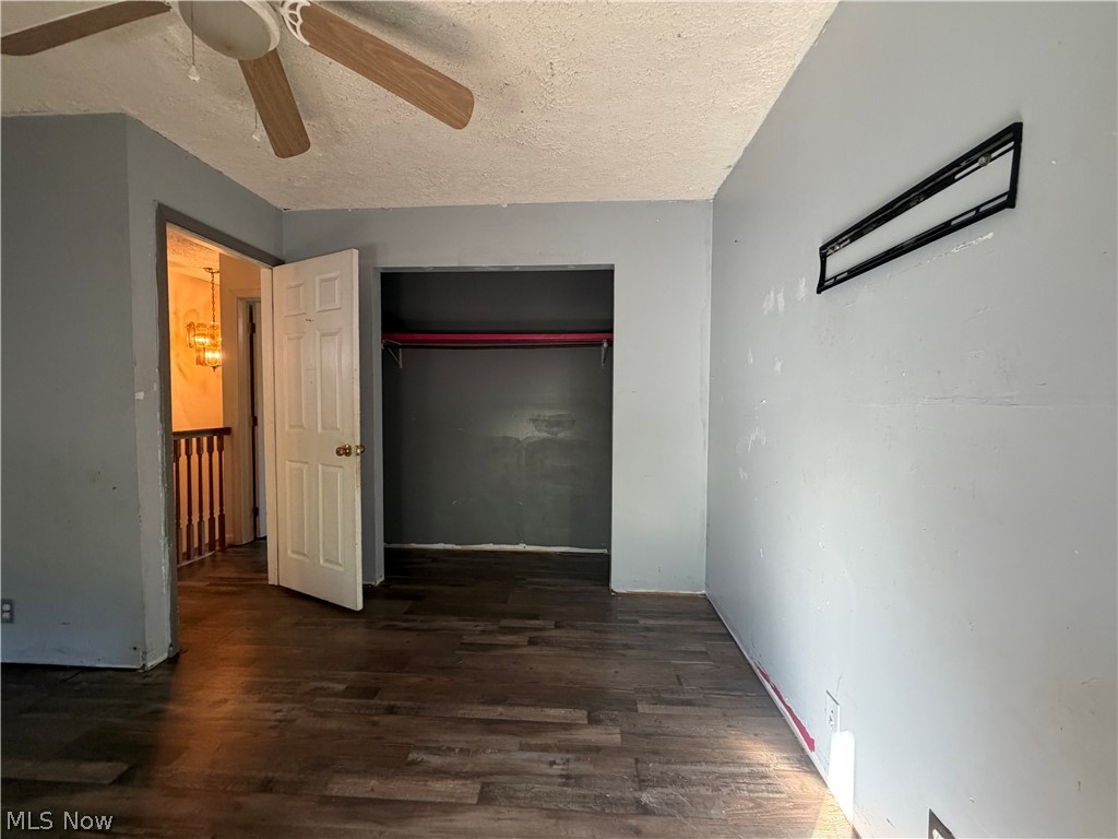 3950 Wolf Road Southwest Port Washington, OH 43837 - Photo 10 of 45 Wood-finish flooring, ceiling fan, and open closet space