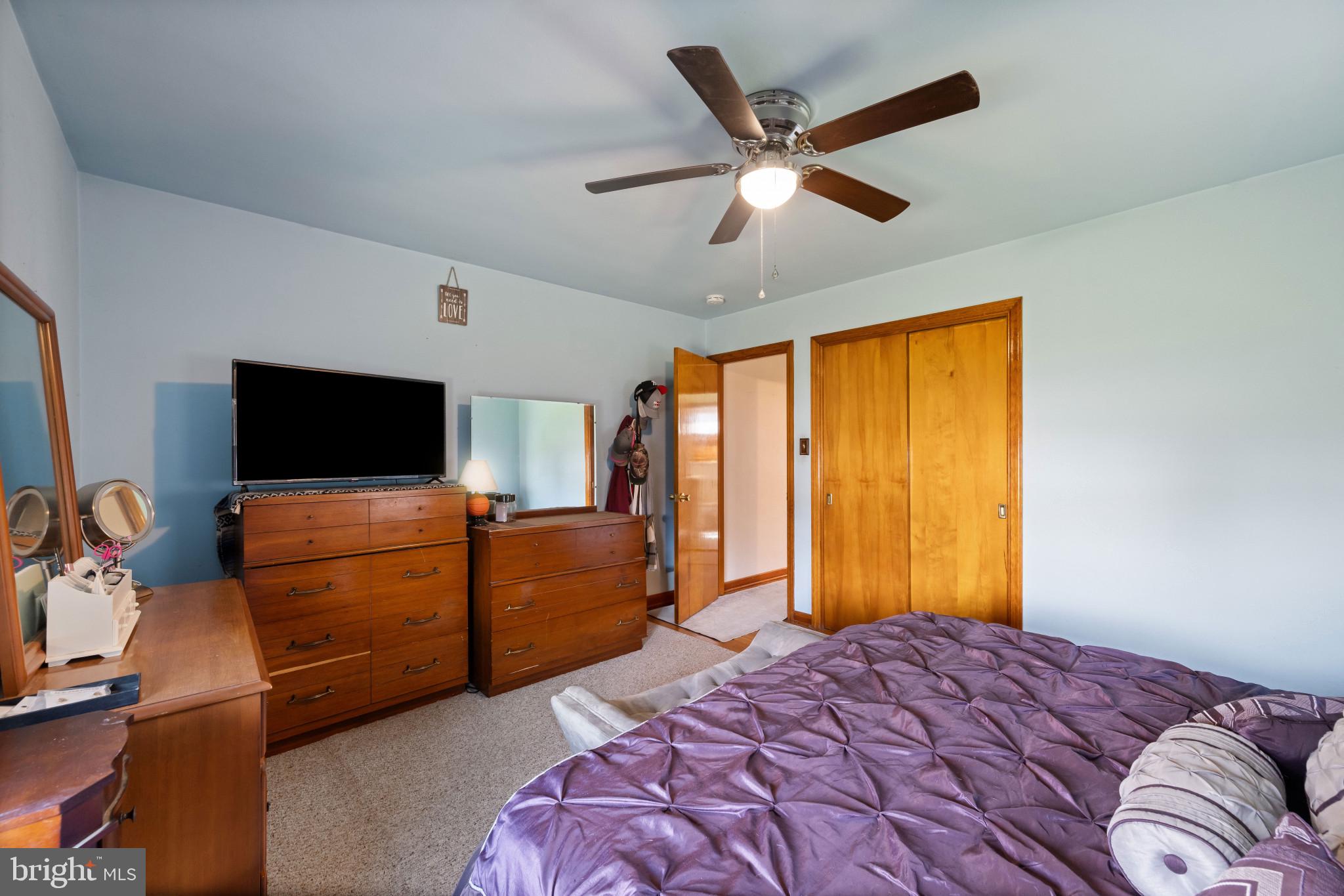 4207 Ralph Avenue Hampstead, MD 21074 - Photo 13 of 33 a bedroom with a bed and a flat screen tv