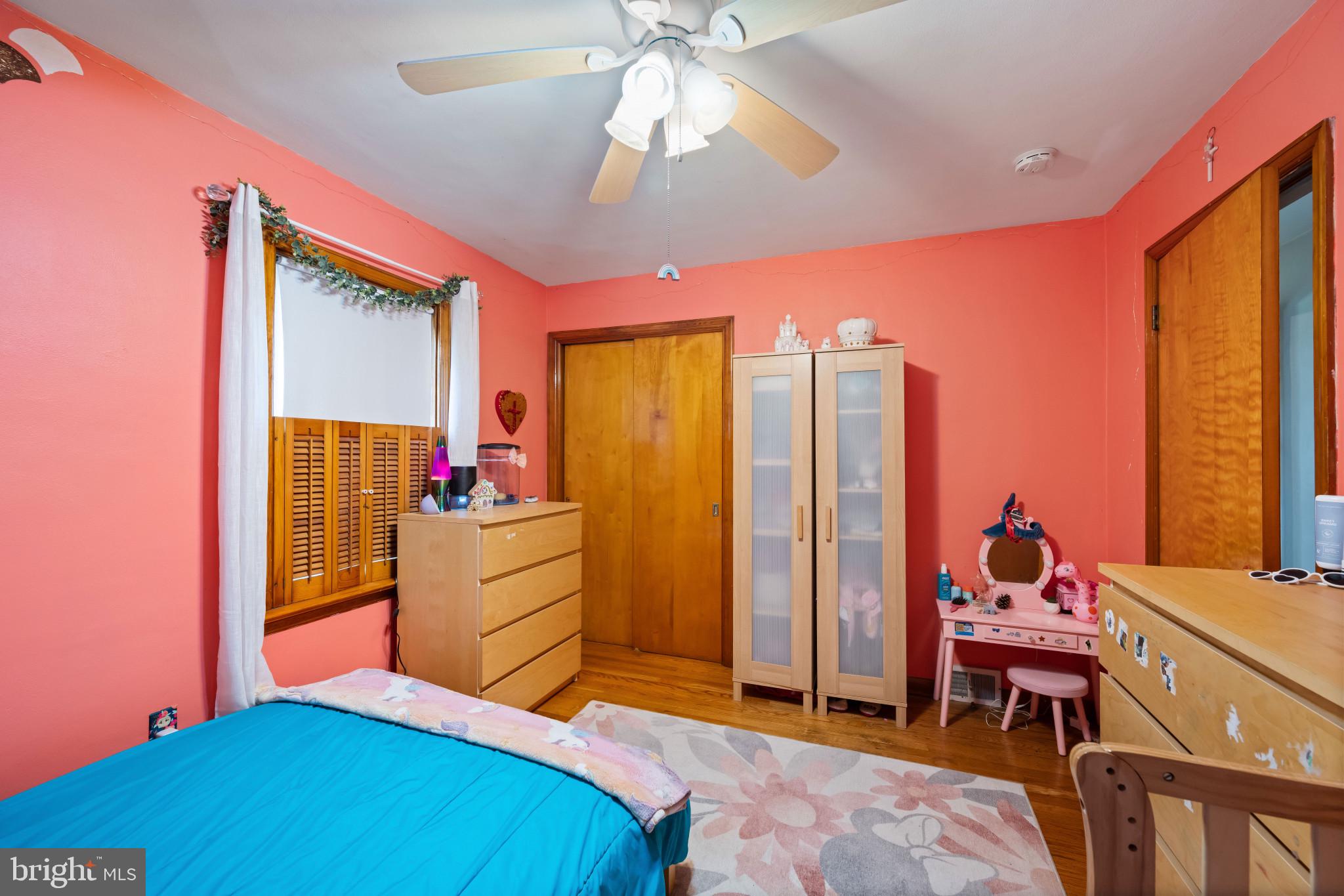 4207 Ralph Avenue Hampstead, MD 21074 - Photo 17 of 33 a bedroom with a bed and a chandelier