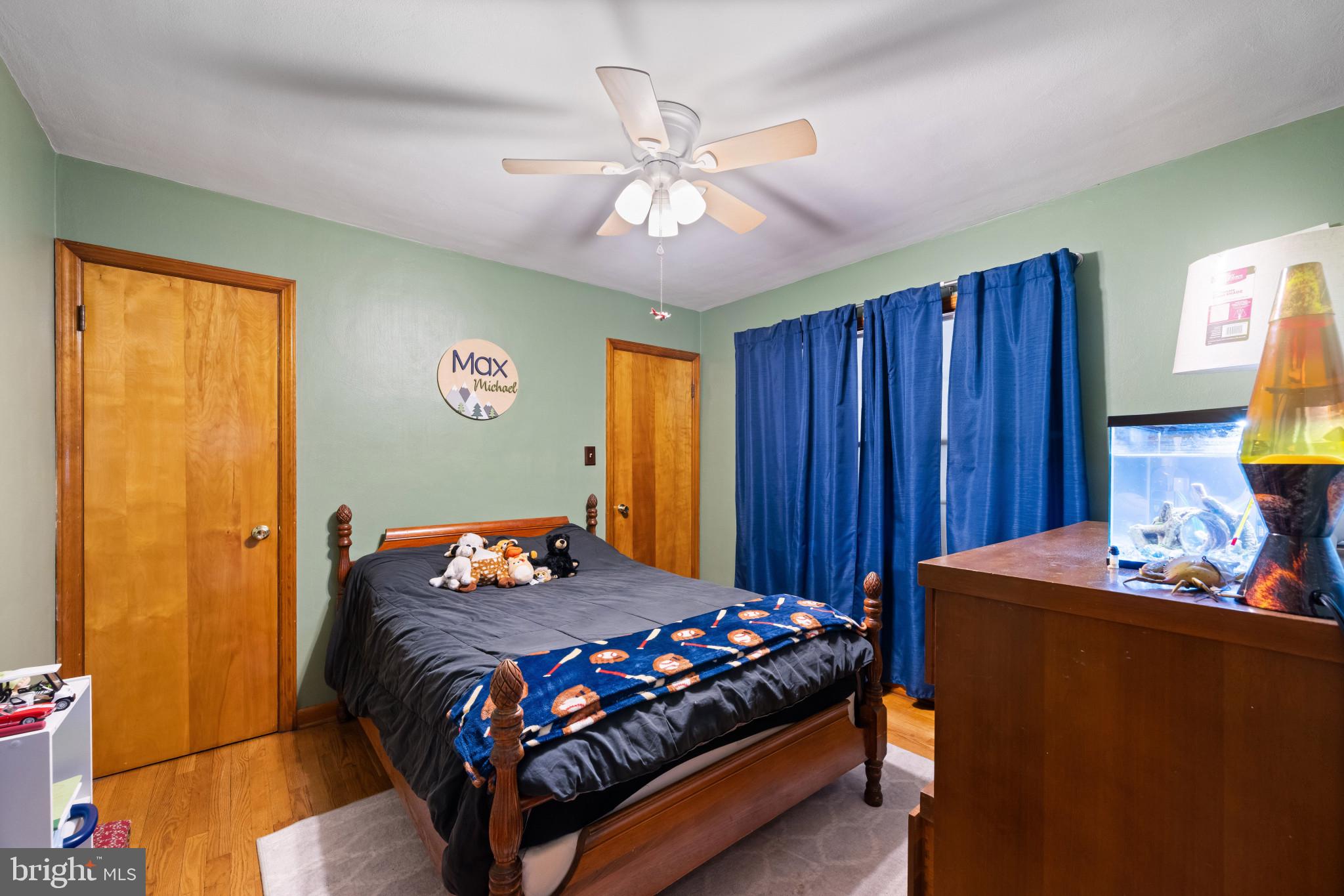 4207 Ralph Avenue Hampstead, MD 21074 - Photo 18 of 33 a bedroom with a bed and wooden floor