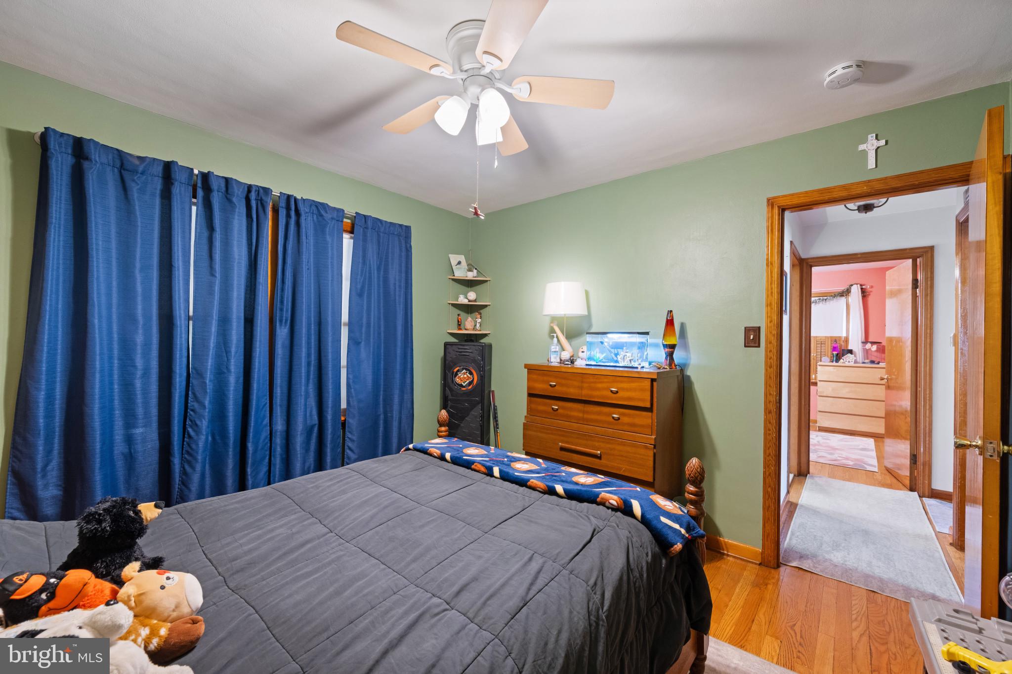 4207 Ralph Avenue Hampstead, MD 21074 - Photo 19 of 33 a bedroom with a bed and a chandelier