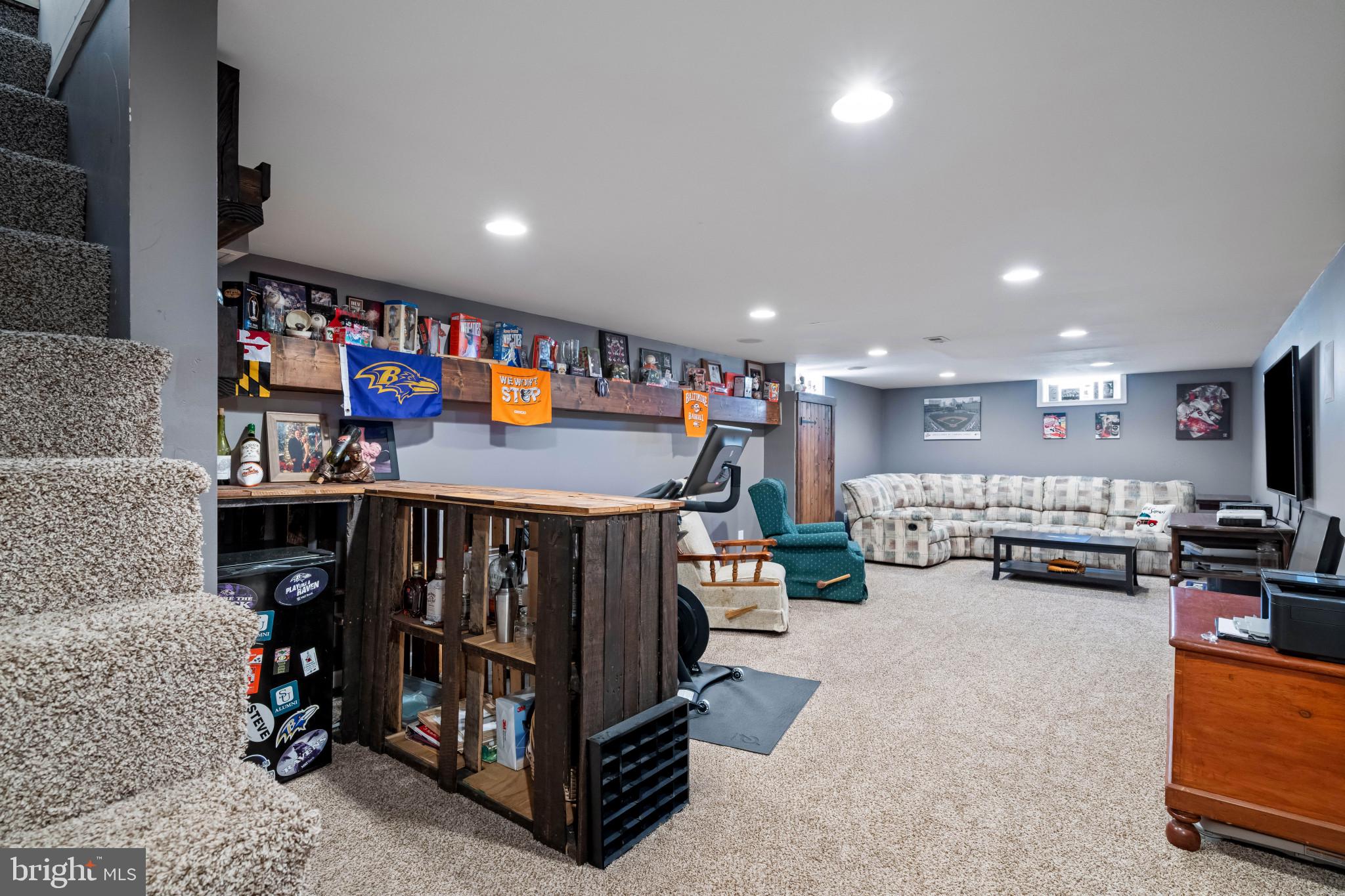 4207 Ralph Avenue Hampstead, MD 21074 - Photo 21 of 33 a room with lots of furniture and a flat screen tv