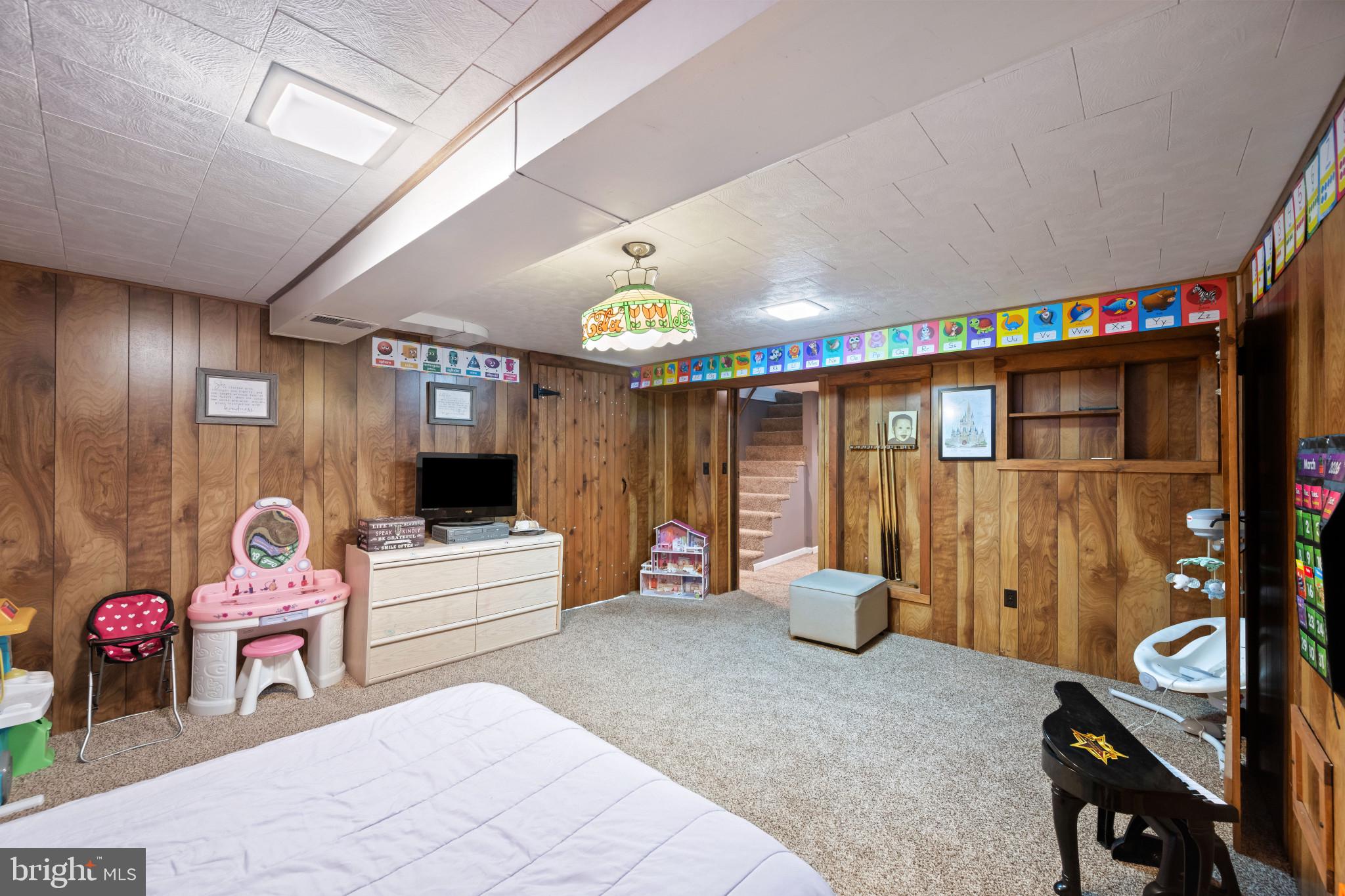 4207 Ralph Avenue Hampstead, MD 21074 - Photo 22 of 33 a living room with furniture and a flat screen tv