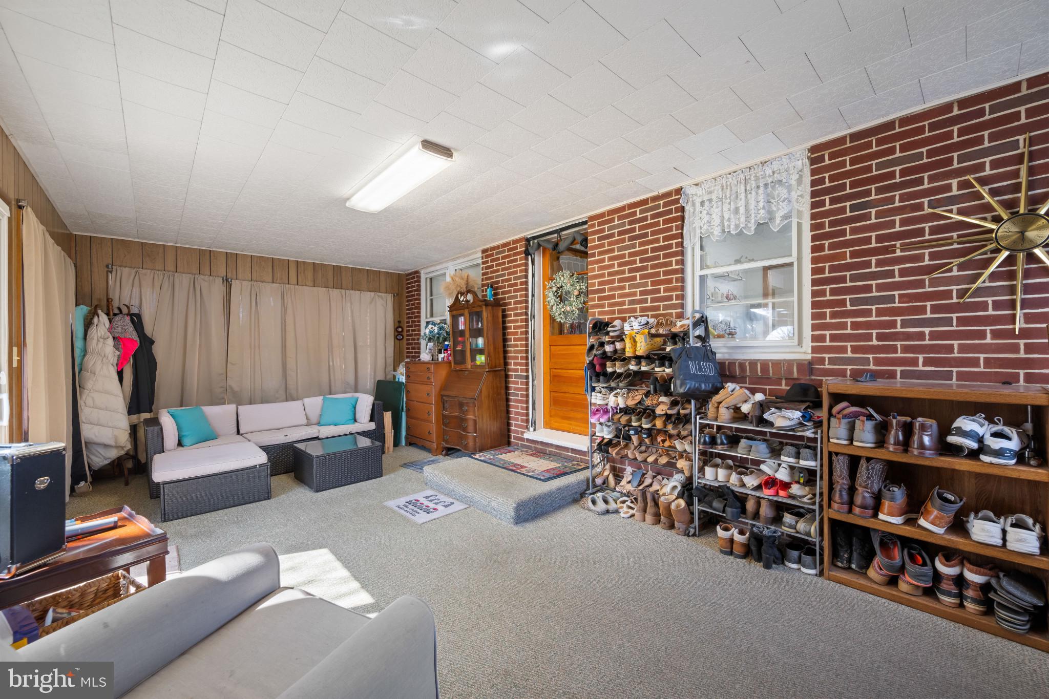 4207 Ralph Avenue Hampstead, MD 21074 - Photo 25 of 33 a living room with lots of furniture and a flat screen tv