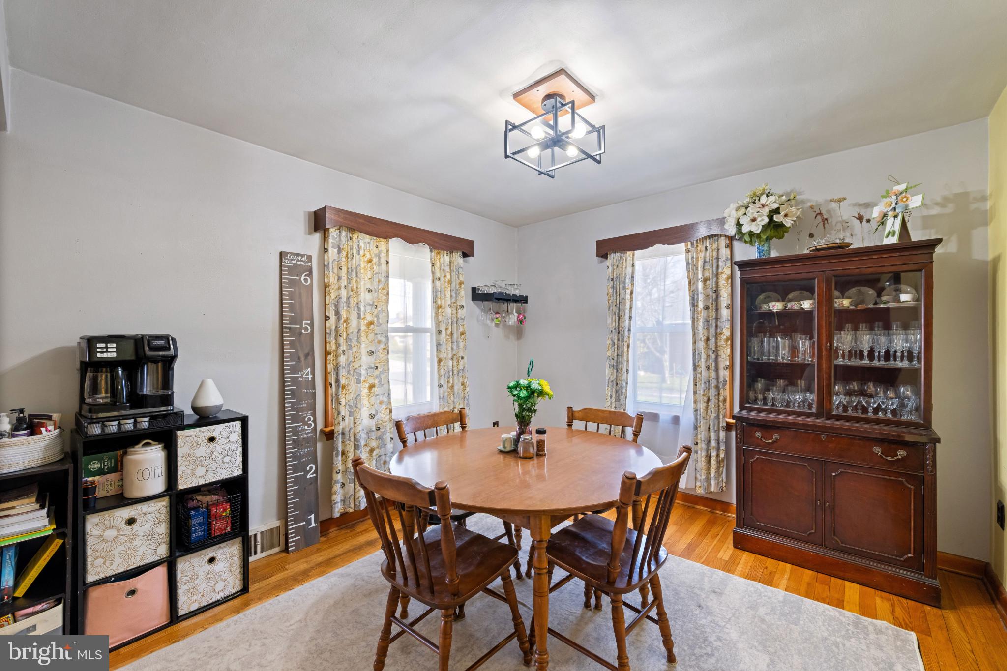 4207 Ralph Avenue Hampstead, MD 21074 - Photo 6 of 33 a view of a dining room with furniture and chandelier
