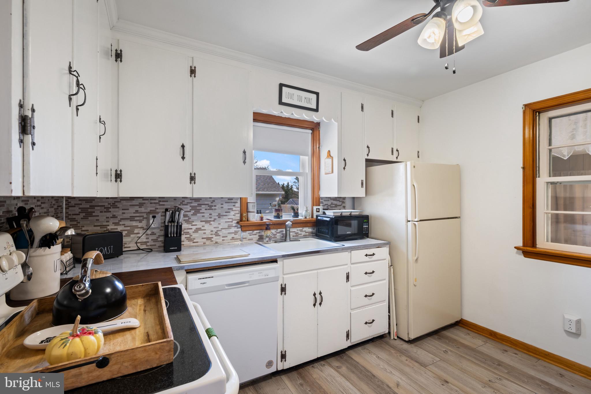 4207 Ralph Avenue Hampstead, MD 21074 - Photo 10 of 33 a kitchen with appliances a sink and cabinets