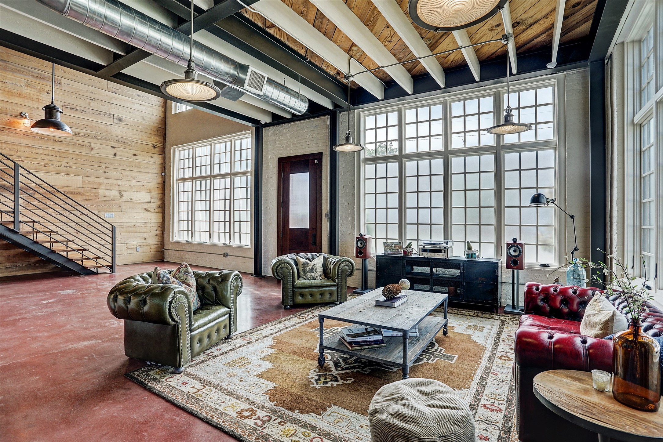808 Coronado Street Houston, TX 77009 - Photo 5 of 50 Unit 1, View of the front entrance from inside Unit 1, highlighting industrial windows and open-concept entry.