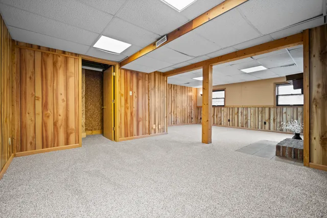 a view of an empty room with a fireplace