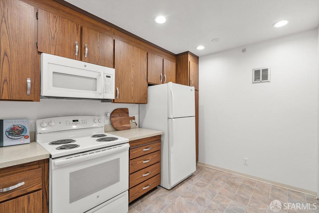 332 Philip Drive, Unit 103 Daly City, CA 94015 - Photo 11 of 37 a view of kitchen with washer and dryer
