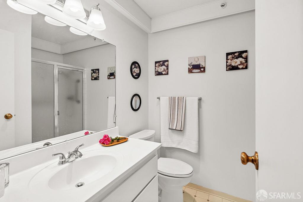 332 Philip Drive, Unit 103 Daly City, CA 94015 - Photo 15 of 37 a bathroom with a sink mirror vanity and toilet
