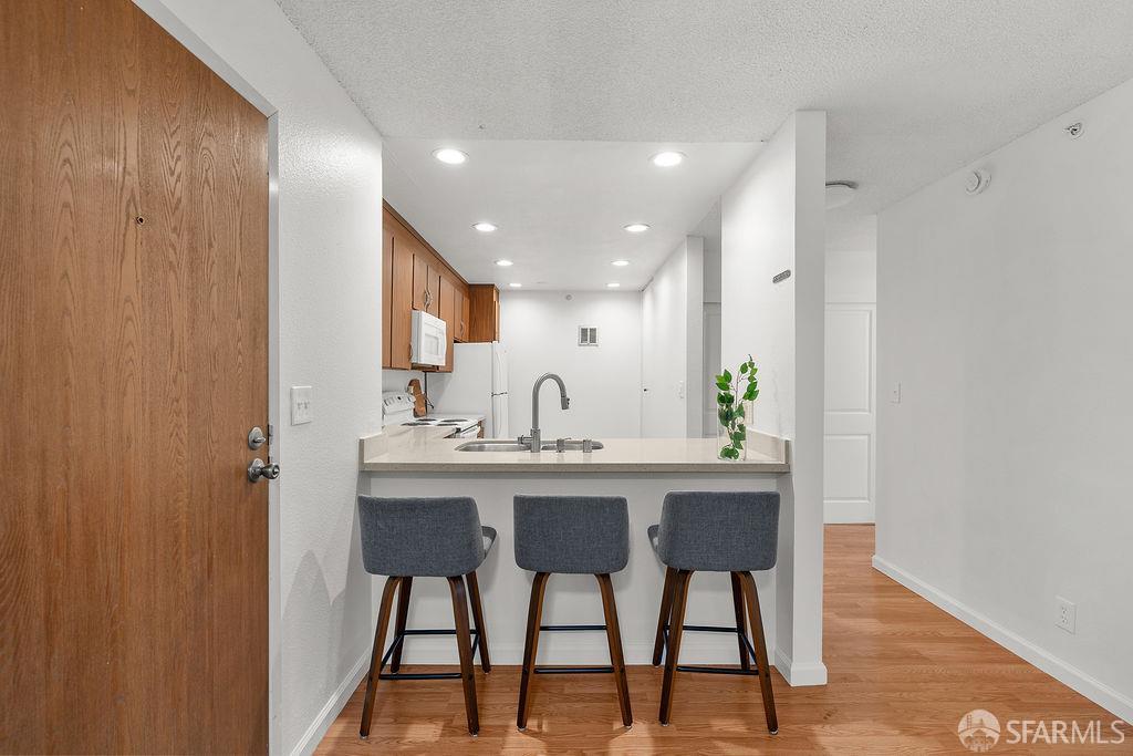 332 Philip Drive, Unit 103 Daly City, CA 94015 - Photo 2 of 37 a view of a dining room with furniture and wooden floor
