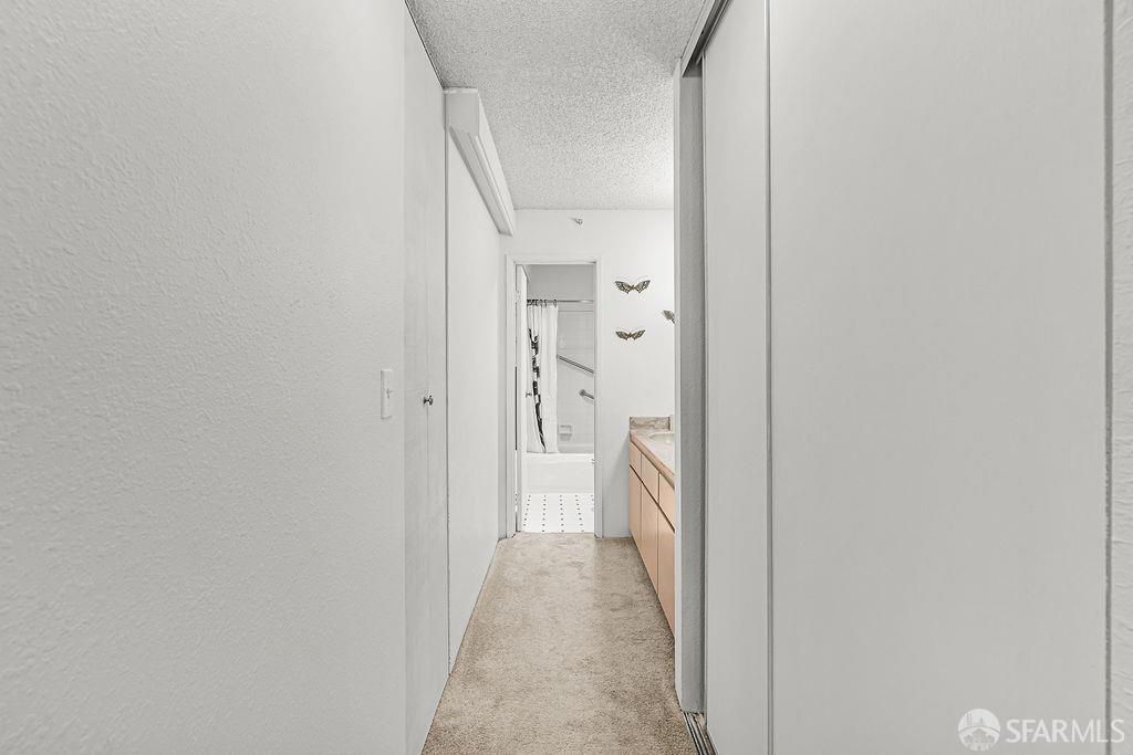 332 Philip Drive, Unit 103 Daly City, CA 94015 - Photo 22 of 37 a view of a hallway with a white walls