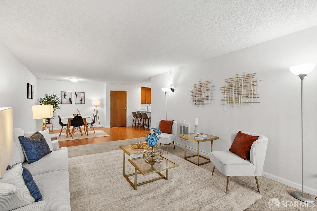 332 Philip Drive, Unit 103 Daly City, CA 94015 - Photo 5 of 37 a living room with furniture and wooden floor