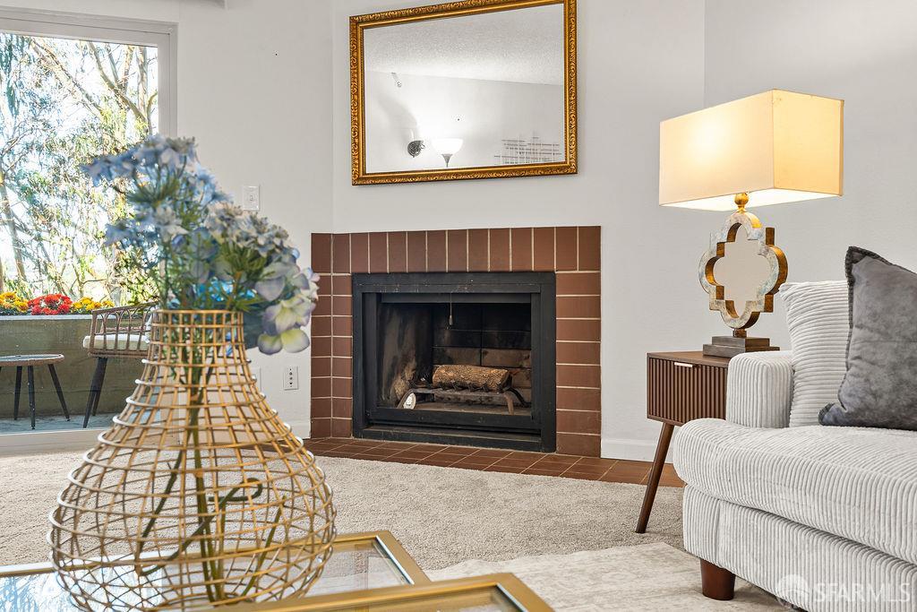 332 Philip Drive, Unit 103 Daly City, CA 94015 - Photo 7 of 37 a living room with furniture and a fireplace