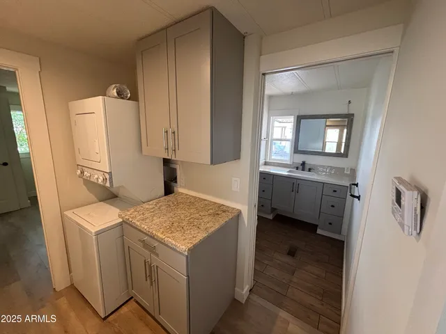 a utility room with a sink a washer and dryer