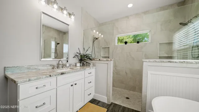a view of kitchen with cabinets and wooden floor