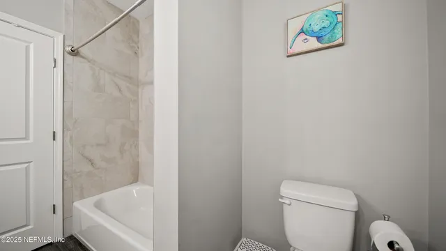 a bed room with a bed and a chandelier