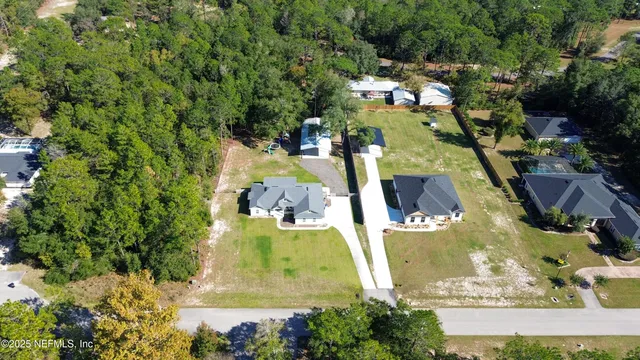 an aerial view of a house with outdoor space