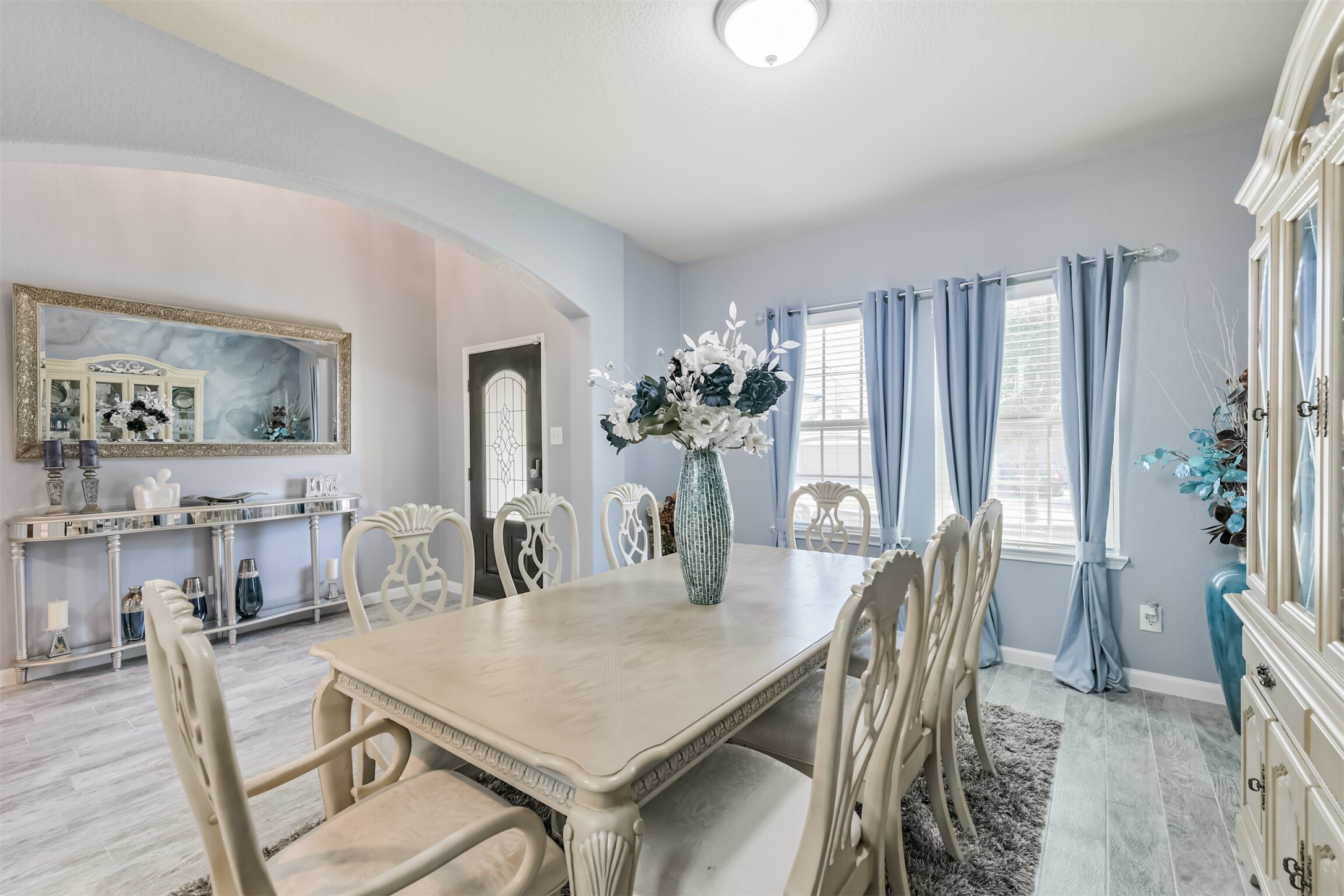 24047 Schults Meadow Lane Spring, TX 77389 - Photo 6 of 47 a view of a dining room with furniture and wooden floor
