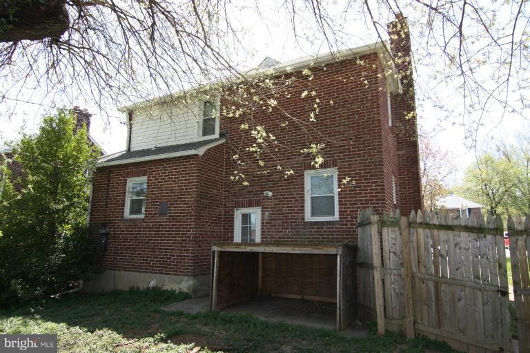 703 Dorchester Road Baltimore, MD 21229 - Photo 1 of 27 a view of house with a yard