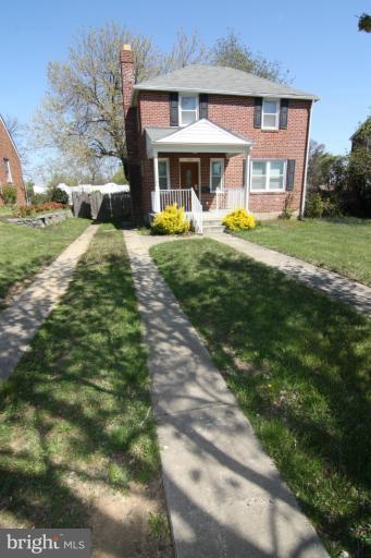 703 Dorchester Road Baltimore, MD 21229 - Photo 16 of 27 a view of a house with a yard patio and a patio